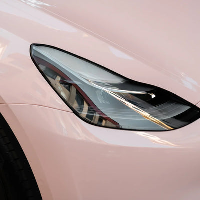 Tesla in High Gloss Strawberry Milk Vinyl Wrap headlight