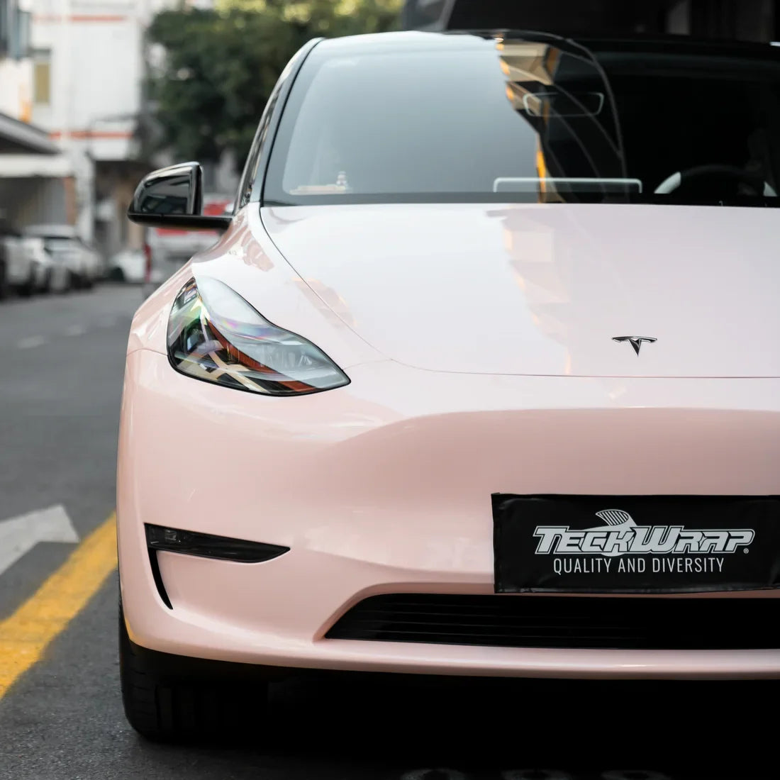 Tesla in High Gloss Strawberry Milk Vinyl Wrap car