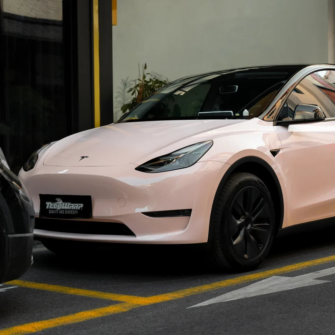 Tesla showcasing High Gloss Strawberry Milk Vinyl Wrap