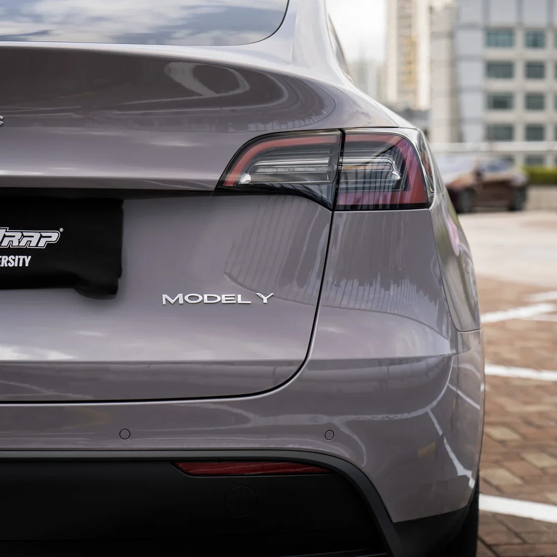 Tesla showcasing Wild Dove Super High Gloss Solid vinyl wrap.