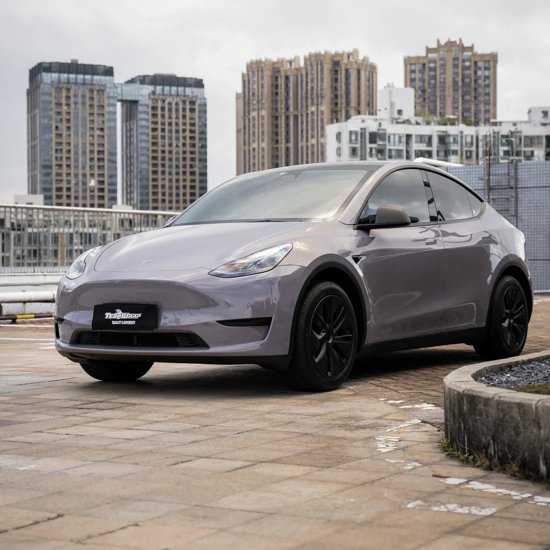 Tesla in Wild Dove Solid High Super Gloss vinyl wrap.