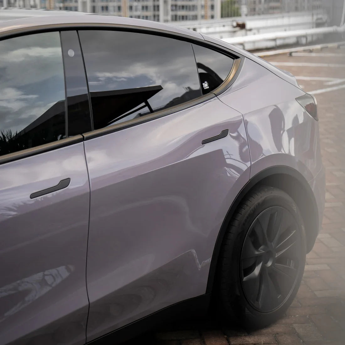 Tesla showcasing Wild Dove High Super Gloss Solid vinyl finish.