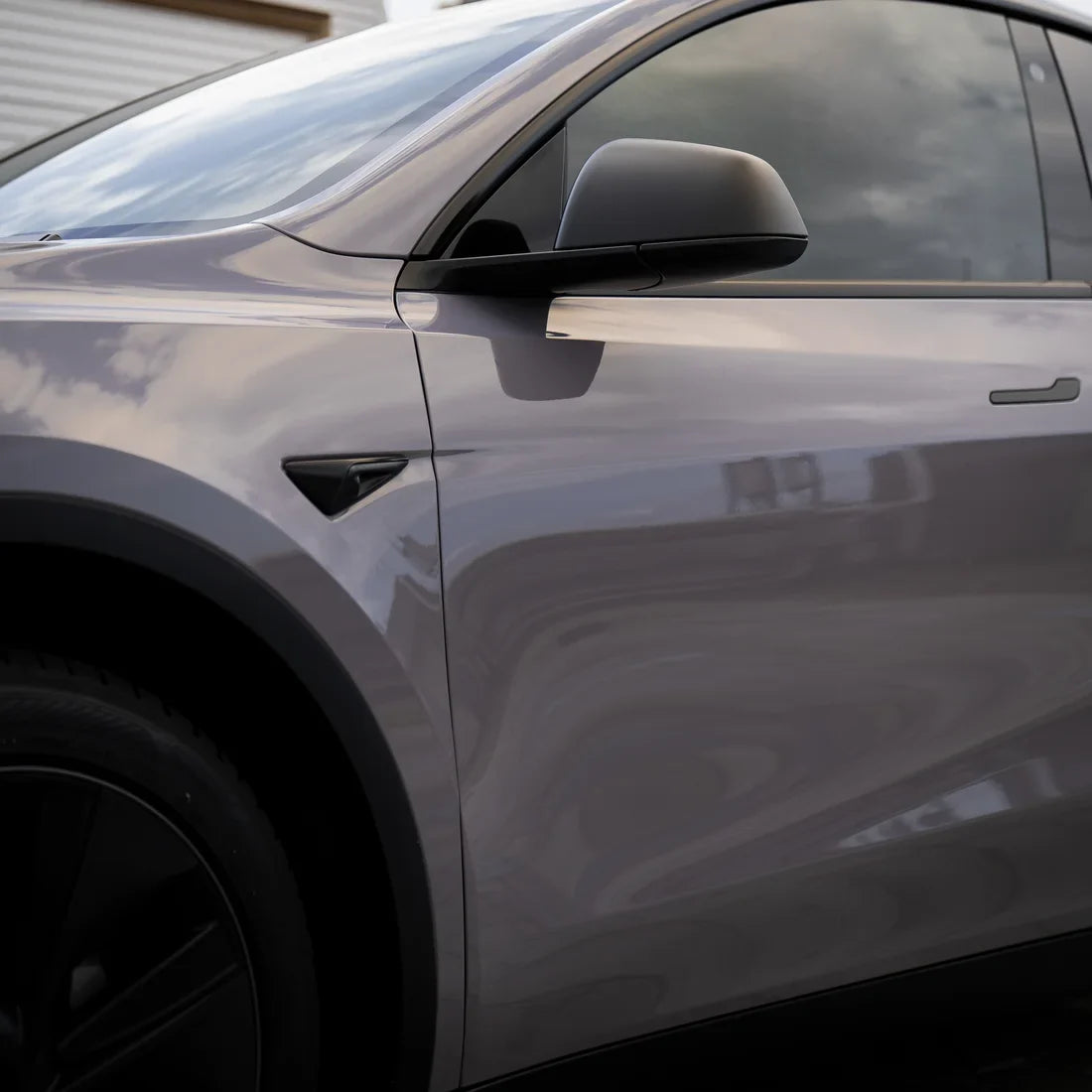 Tesla showcasing High Gloss Wild Dove Vinyl Wrap Side Mirror.