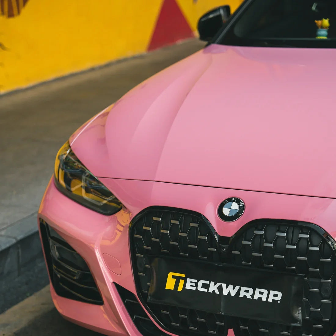 BMW showcasing High Gloss Flamingo Pink Vinyl Wrap.