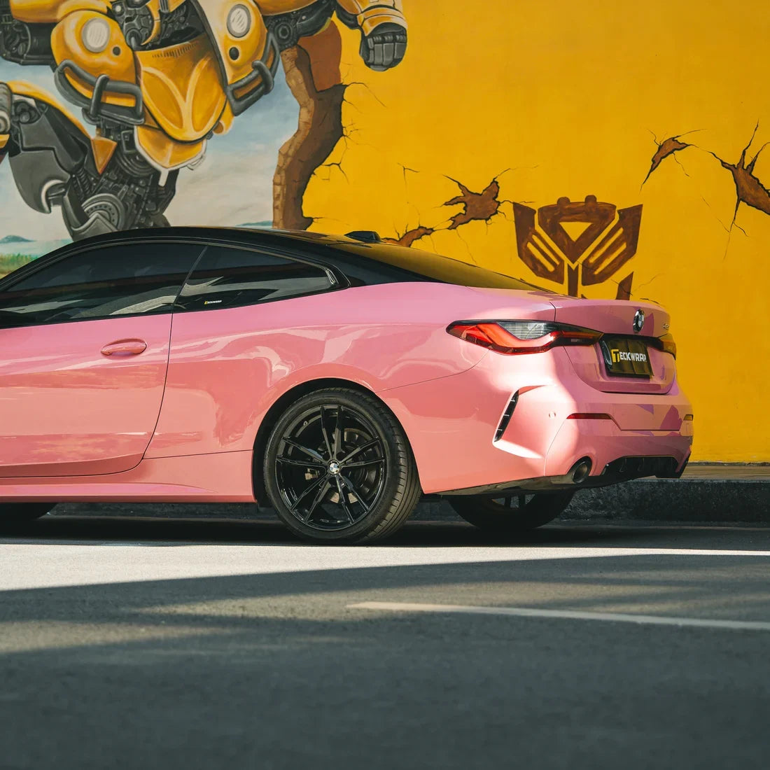 BMW showcasing a High Gloss Flamingo Pink Vinyl Wrap.