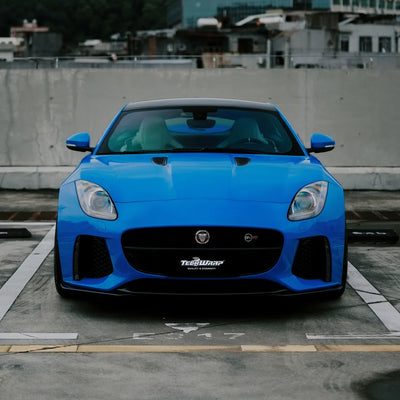 Jaguar showcasing a High Gloss Vibrant Blue Vinyl Wrap finish.
