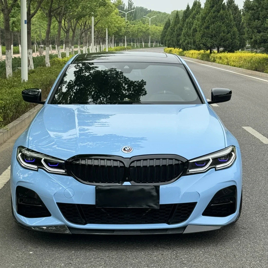 BMW in High Gloss Baby Blue Vinyl Wrap Front View