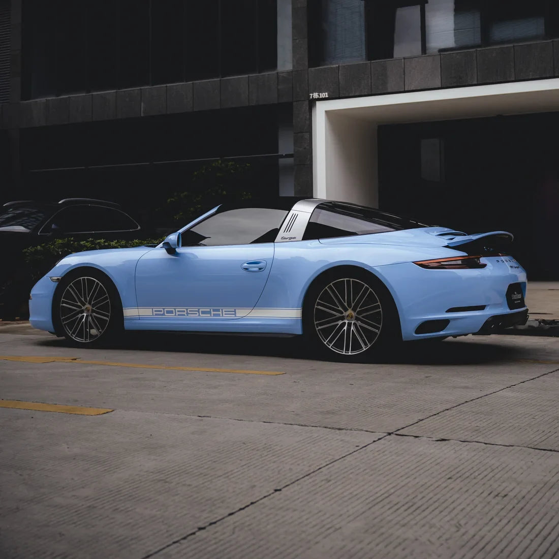 High Gloss Baby Blue Vinyl Wrap on Porsche side