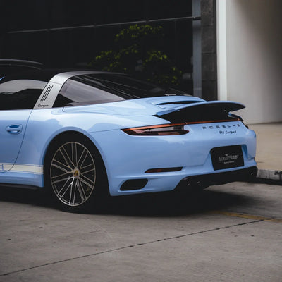 High Gloss Baby Blue Vinyl Wrap on Porsche side view