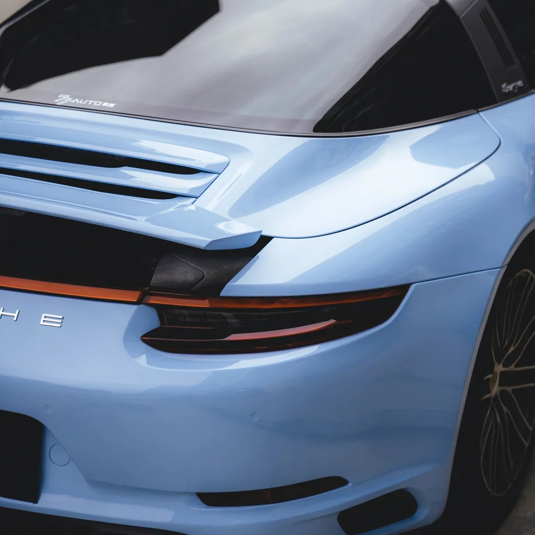 High Gloss Baby Blue Vinyl Wrap on Porsche rear light