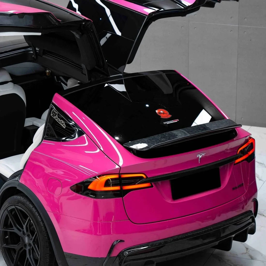 Tesla in High Gloss Sorbet Pink Vinyl Wrap