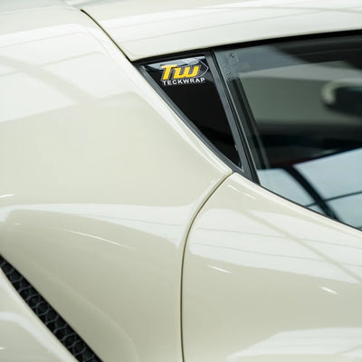 Ferrari in a smooth High Gloss Vanilla Mist Vinyl Wrap.