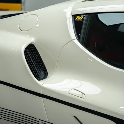 Ferrari with a High Gloss Vanilla Mist Vinyl Wrap look.