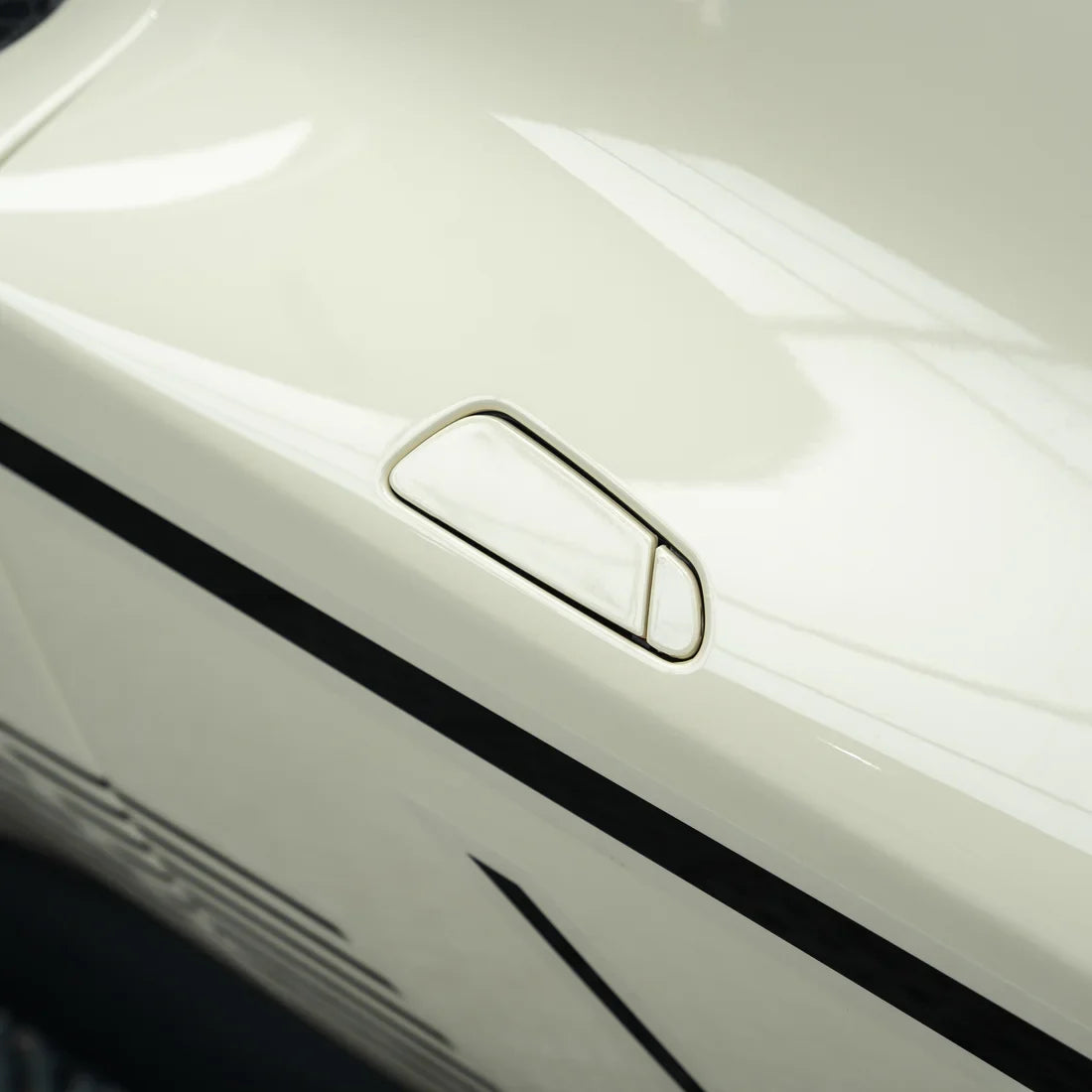 Ferrari showcasing a High Gloss Vanilla Mist Vinyl Wrap finish.