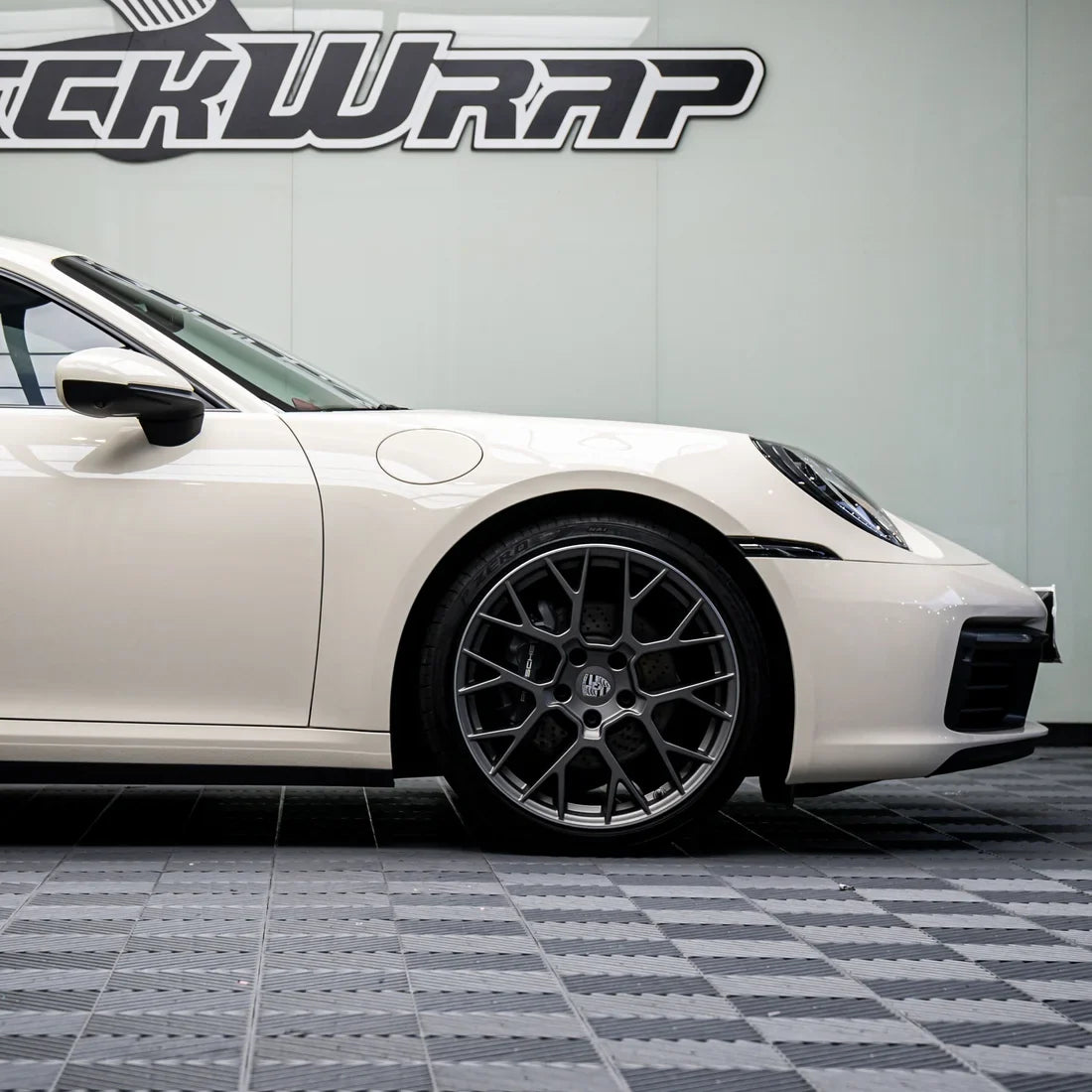 Porsche with a High Gloss Vanilla Mist Vinyl Wrap finish.