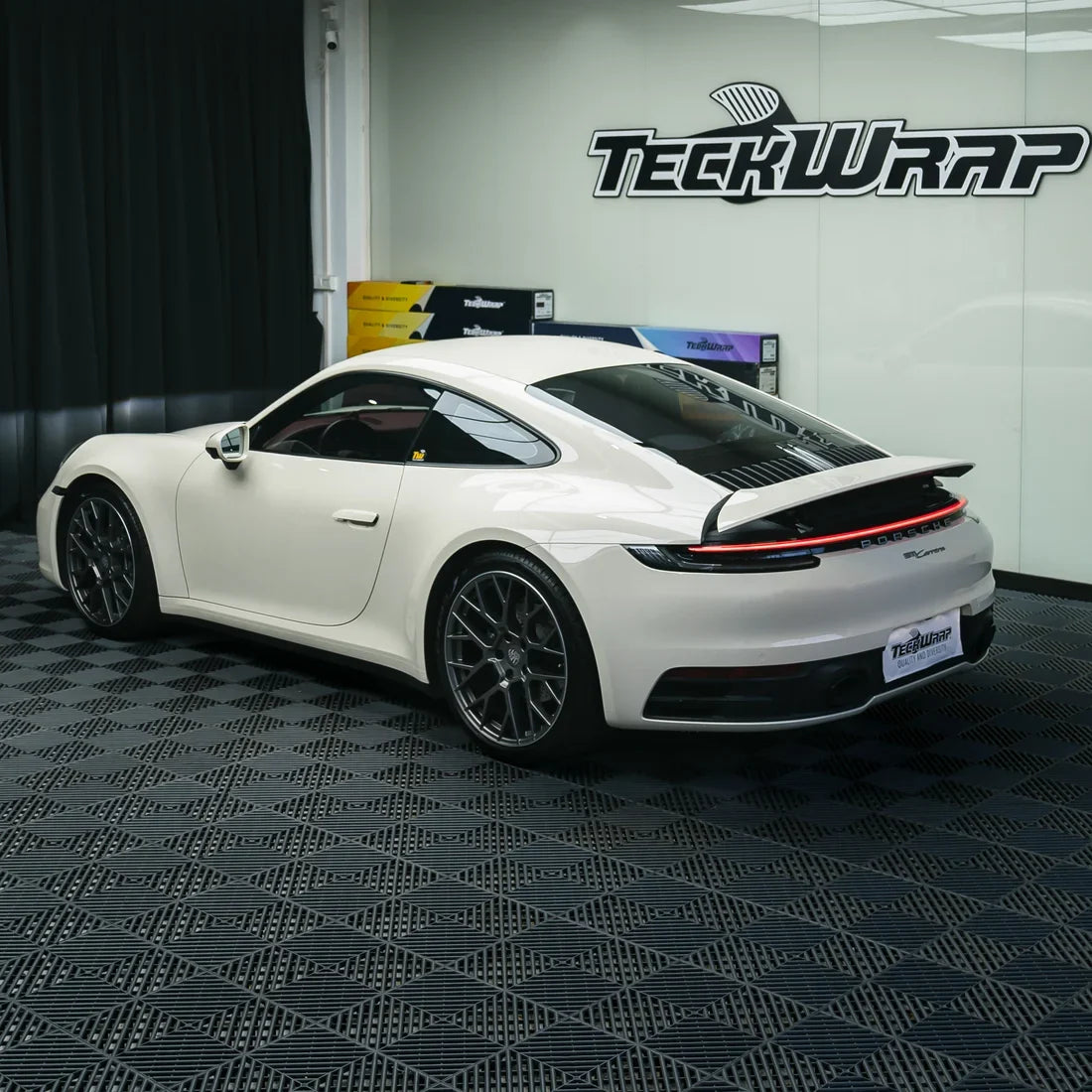Porsche with a High Gloss Vanilla Mist Vinyl Wrap.