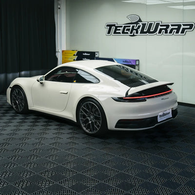 Porsche with a High Gloss Vanilla Mist Vinyl Wrap.