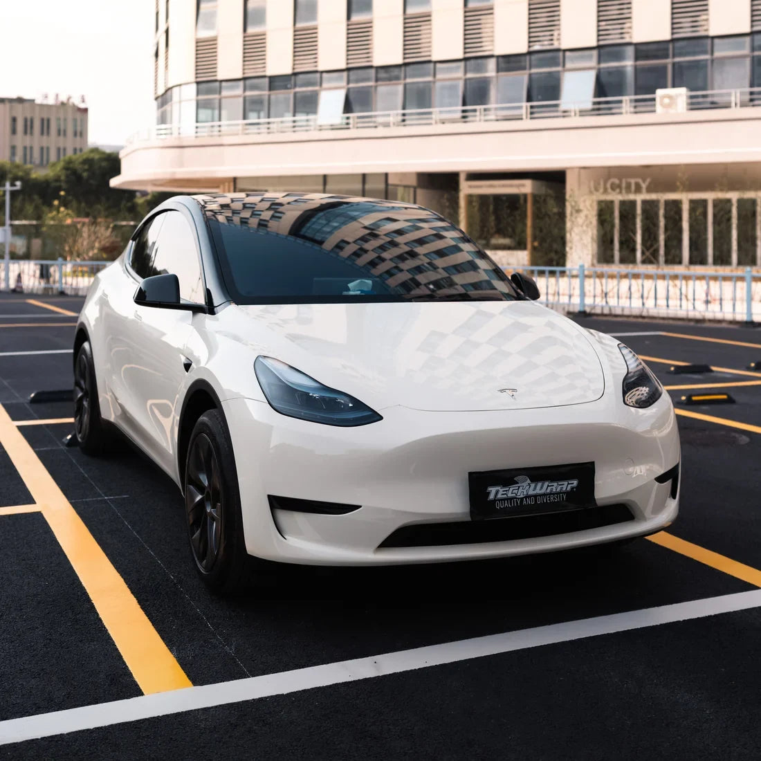 High Gloss Vanilla Mist Vinyl Wrap Tesla showing exterior.