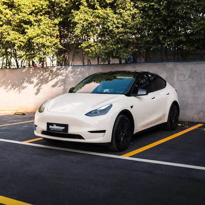 Tesla featuring a High Gloss Vanilla Mist Vinyl Wrap.