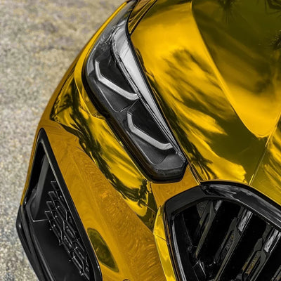 BMW with a bold reflective Yellow Gold Mirror Chrome vinyl wrap.