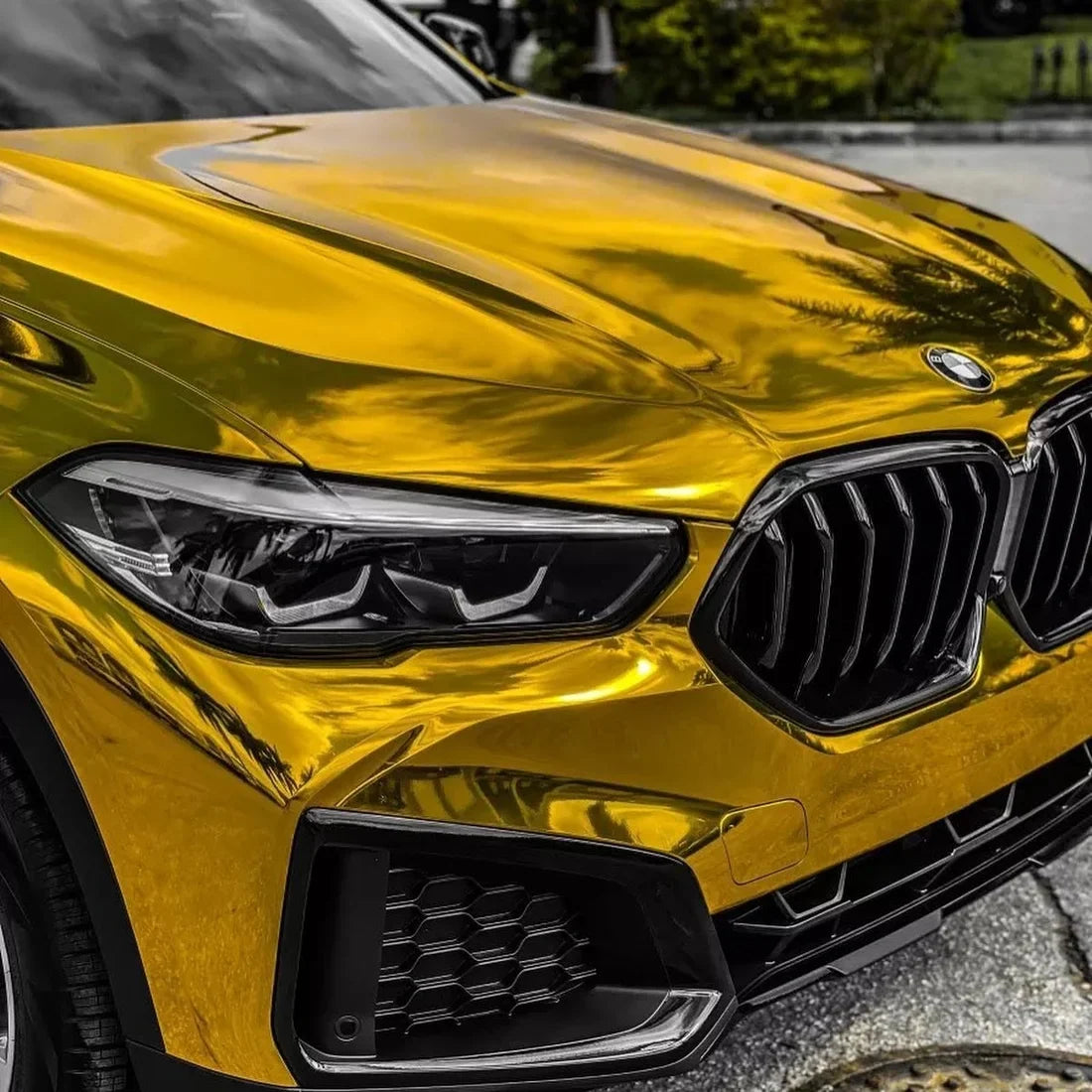 BMW showcasing a vinyl wrap Yellow Gold Mirror Chrome.