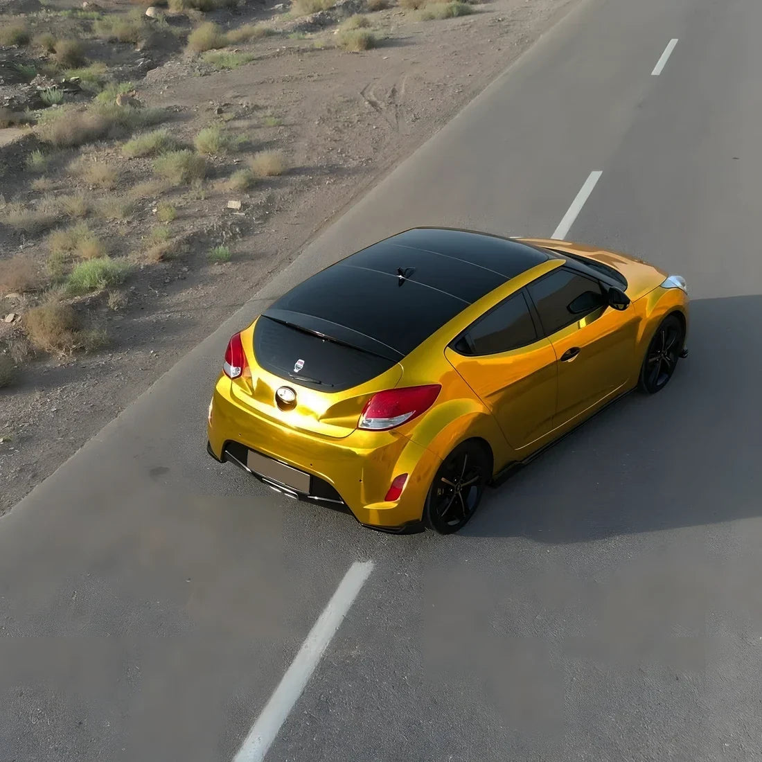 Hyundai showcasing Yellow Gold Mirror Chrome vinyl wrap.