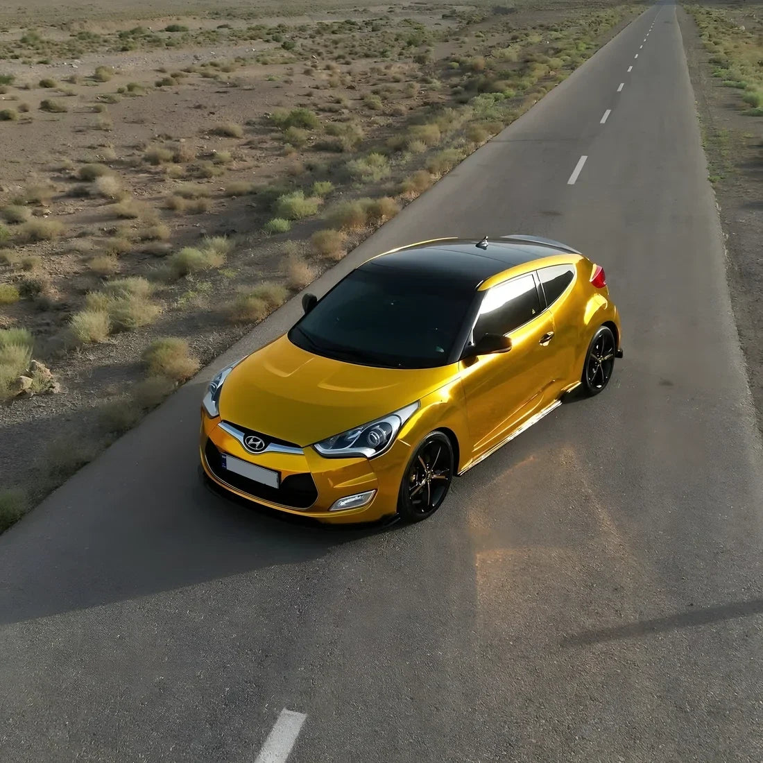 Hyundai wrapped in Yellow Gold Mirror Chrome vinyl wrap.