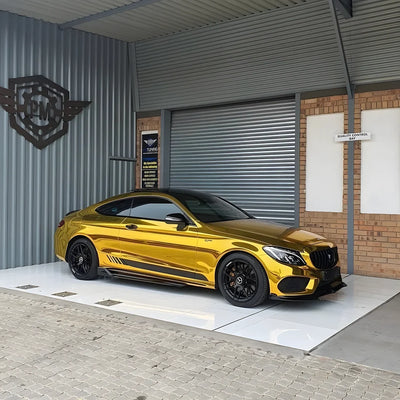 Mercedes with a Yellow Gold Mirror Chrome vinyl wrap.