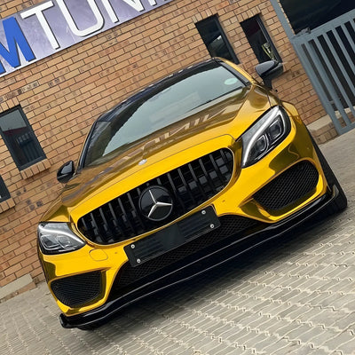 Golden Mercedes wrapped in a Yellow Gold Mirror Chrome vinyl wrap.