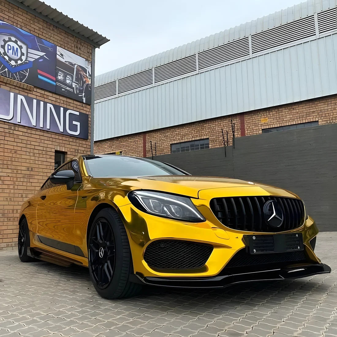 Yellow Gold Mirror Chrome Mercedes with golden vinyl wrap.