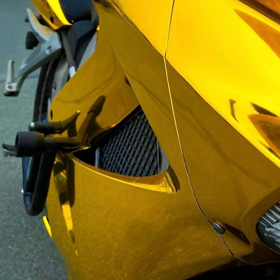 Golden motorcycle featuring a vinyl wrap Mirror Chrome Yellow Gold.