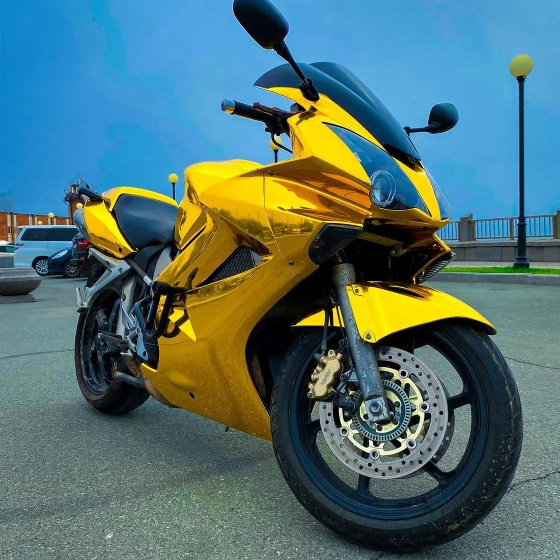 Yellow Gold Mirror Chrome vinyl wrap on motorcycle.