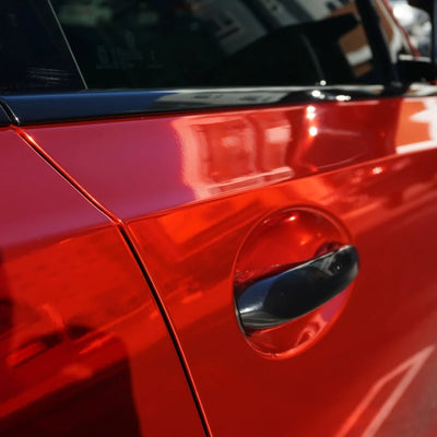 Cherry Red Mirror Chrome BMW vinyl wrap that flecting light.