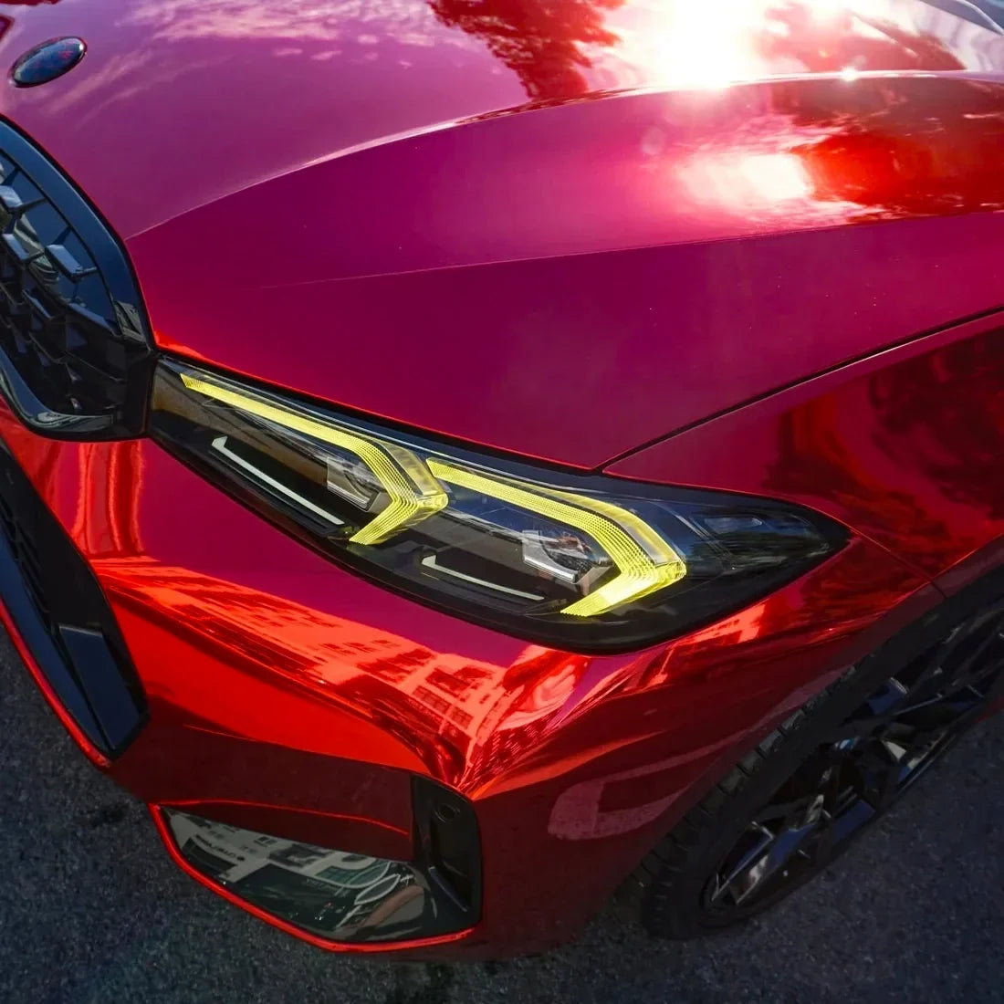 Cherry Red Mirror Chrome vinyl wrap BMW with a vibrant glossy red finish.