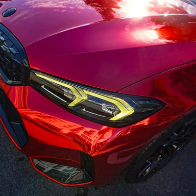 Cherry Red Mirror Chrome vinyl wrap BMW with a vibrant glossy red finish.