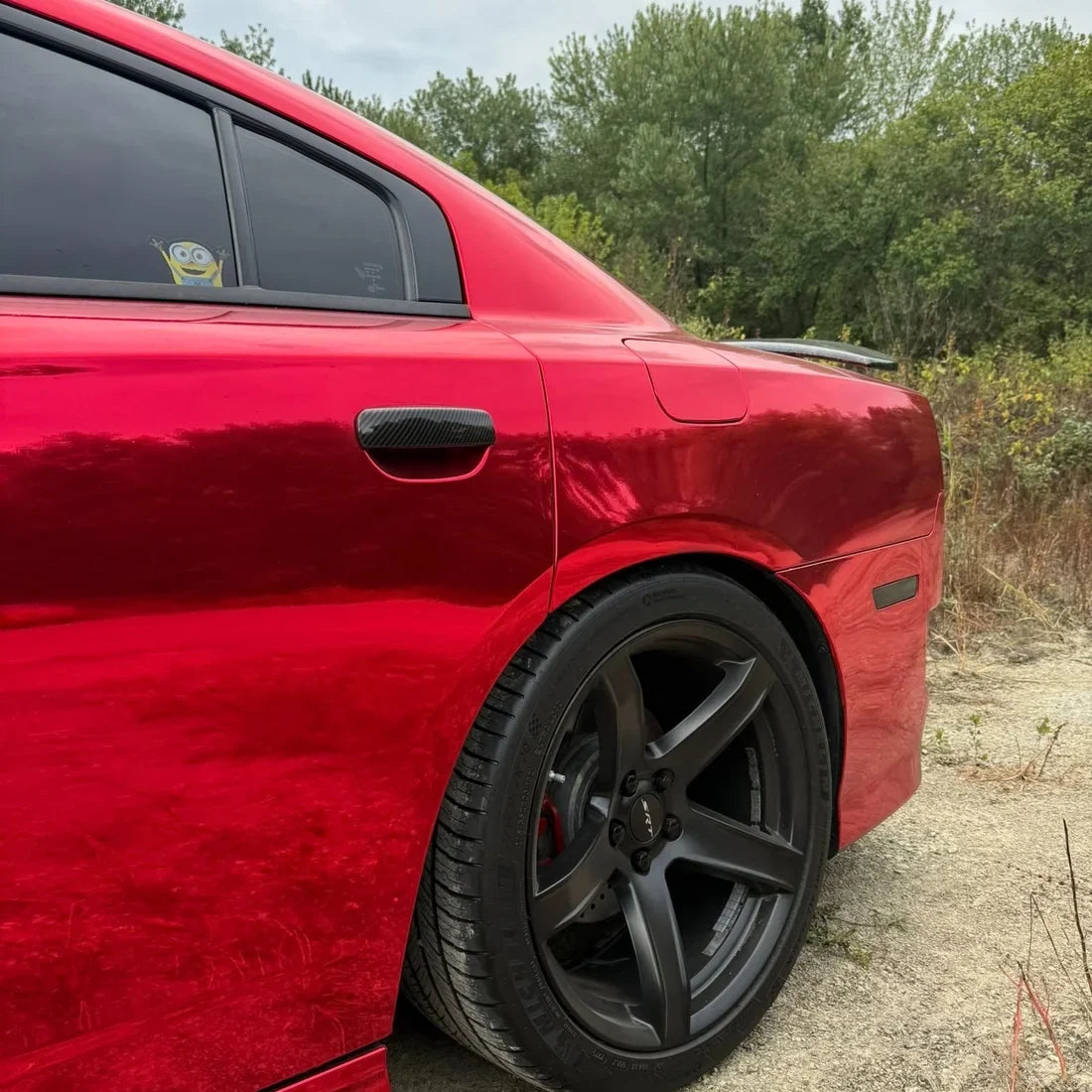 Cherry Red Mirror Chrome vinyl wrap Dodge with a glossy reflective exterior.