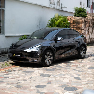 Jet Black Mirror Chrome Tesla showcasing its sleek reflective finish.