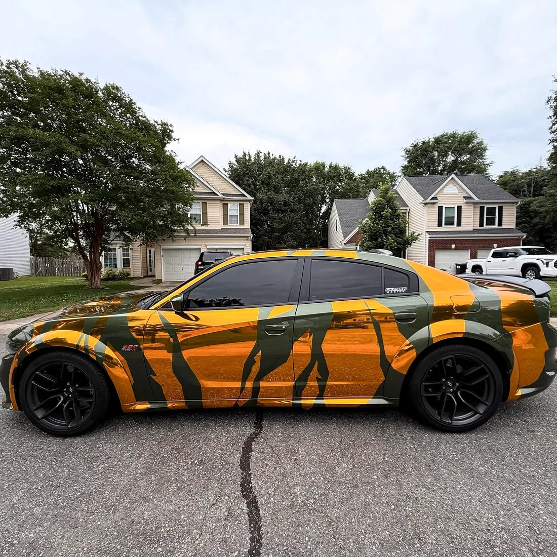 Chrome Solar Gold Vinyl Wrap on SUV.