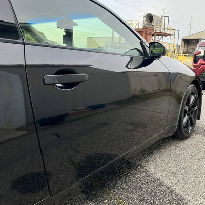 Gloss Metallic Ebony Sparkle Vinyl Wrap car with a deep black wrap.
