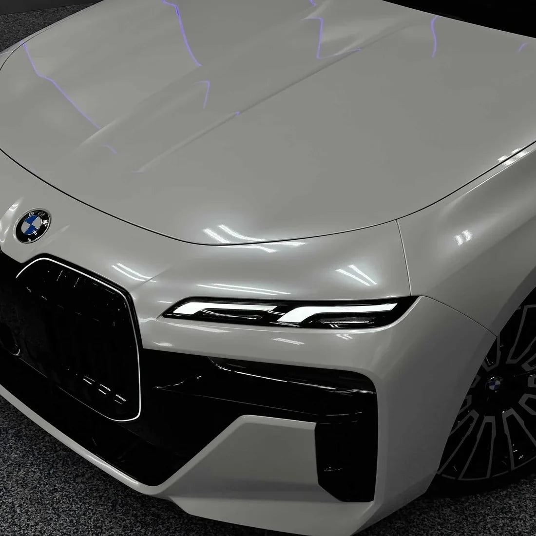 Gloss Color Shift Pearl White Vinyl Wrap on BMW front