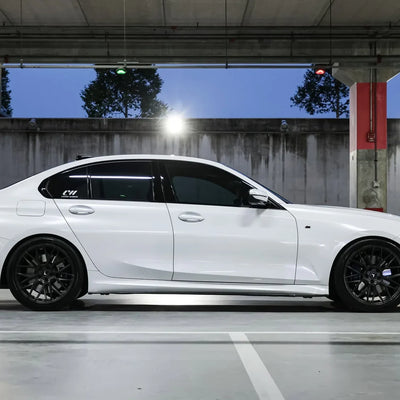 White Pearl Glitter Gloss vinyl wrap BMW 3 Series parked indoors.