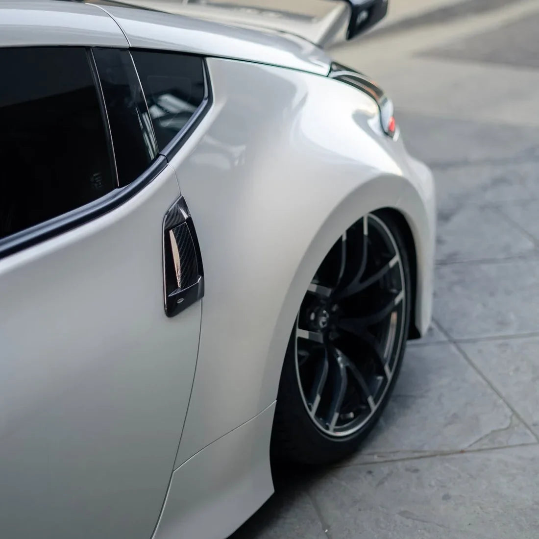 White Pearl Glitter Gloss vinyl wrap Nissan 370Z side detail.