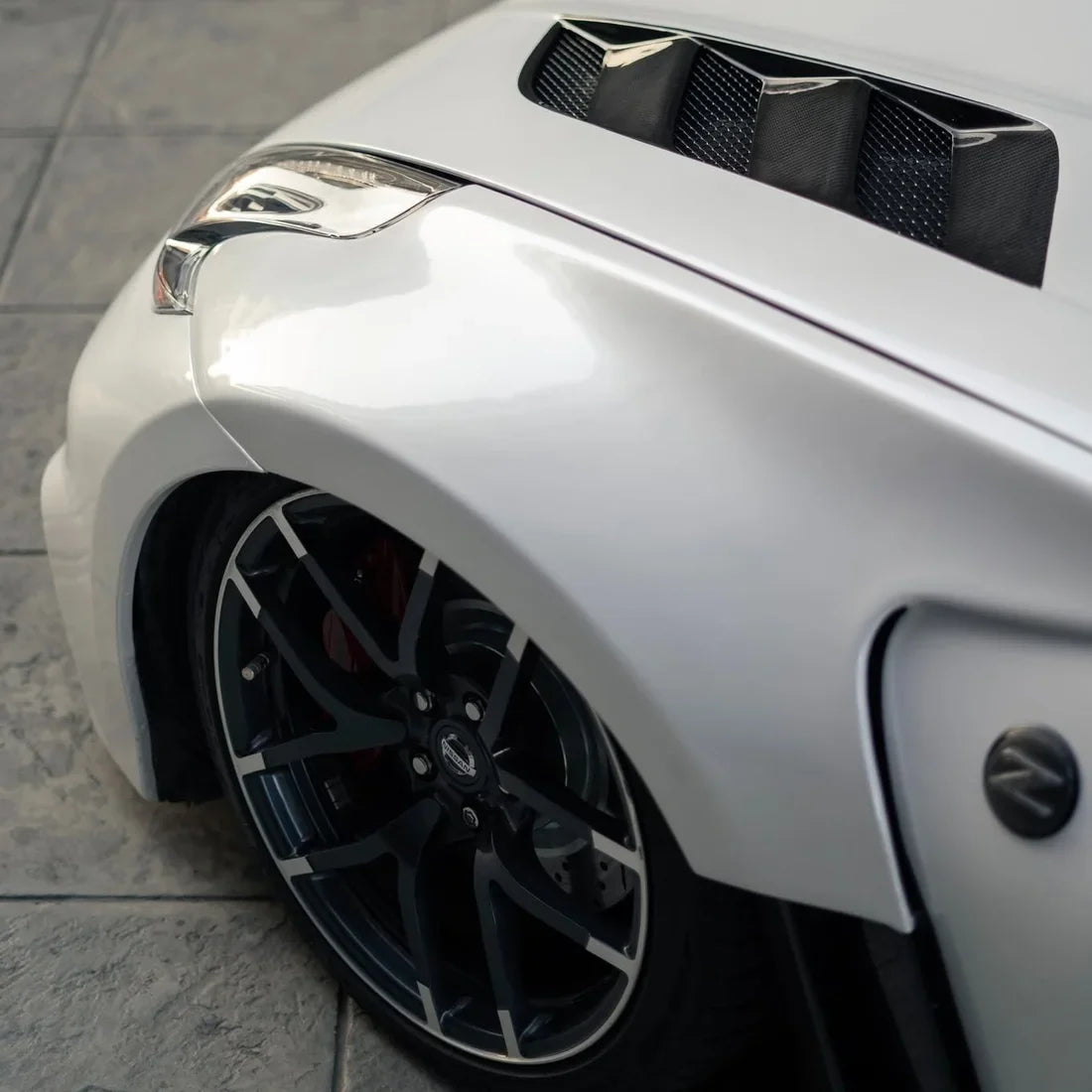 Pearl White Vinyl Wrap on Nissan wheel area