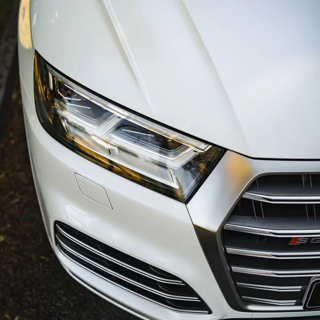 Gloss Light Blue Pearl Vinyl Wrap on Audi headlight