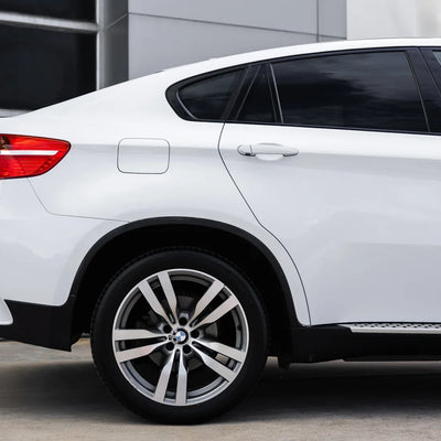 side view of car on the frosted pearl white chameleon vinyl wrap
