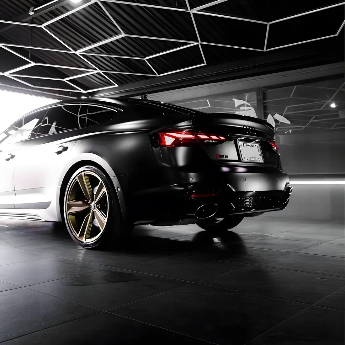 A matte black vinyl wrap on Audi RS6
