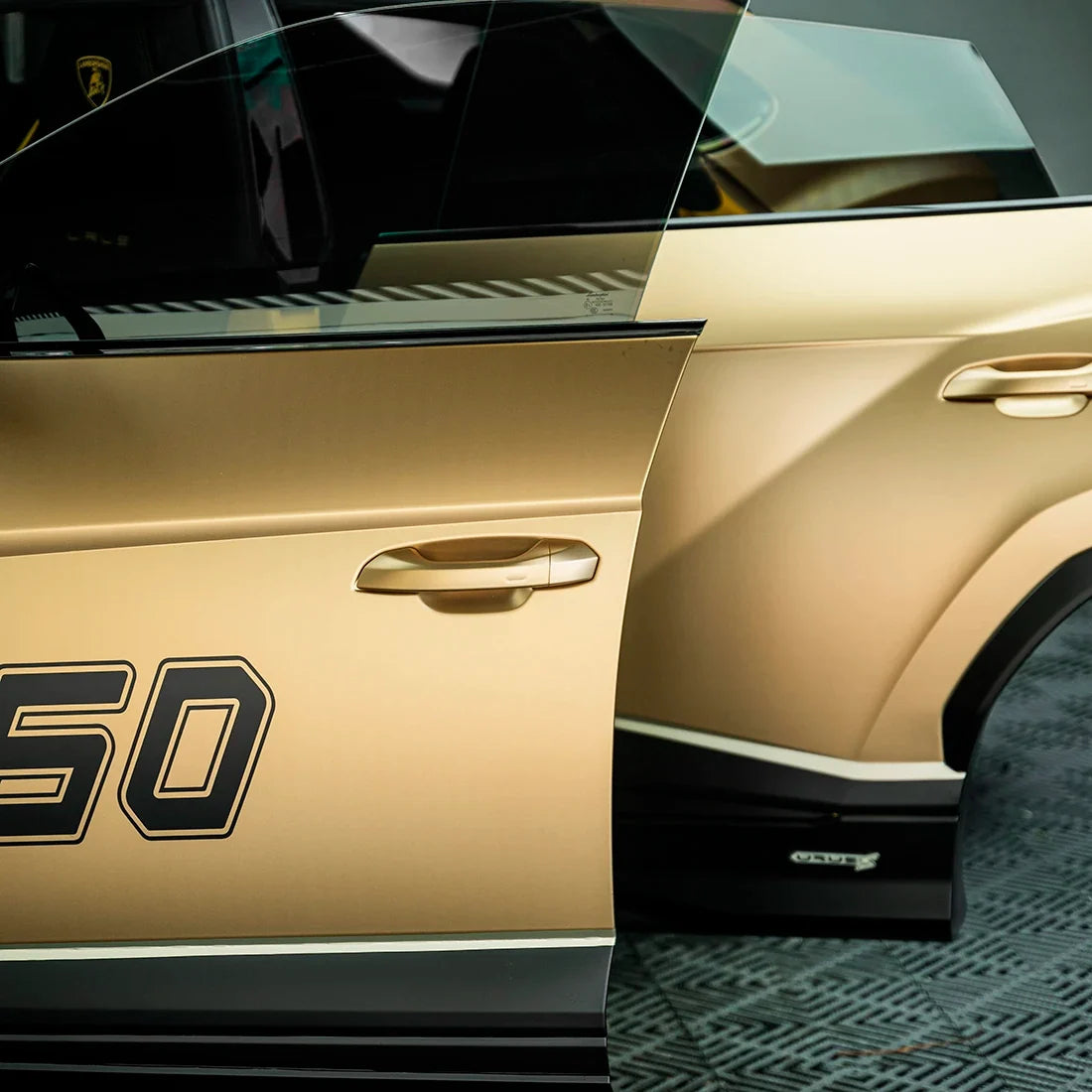 Satin Metallic Imperial Gold Vinyl Wrap on Lamborghini Urus doors