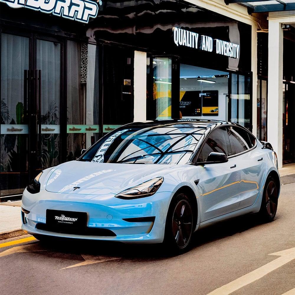 a Tesla Model 3 wrapped in Teckwrap Gloss Azure Maya Blue