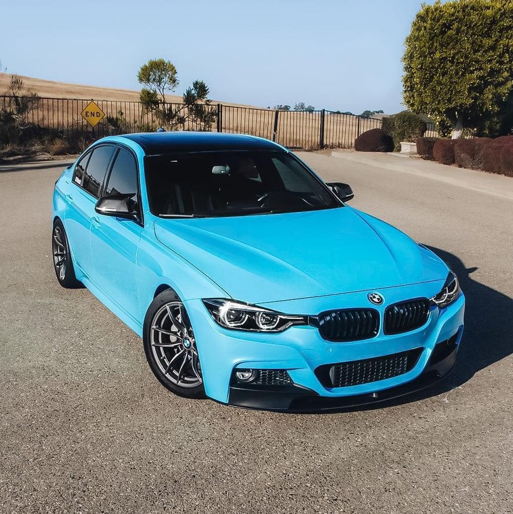Stylish sedan wrapped in Teckwrap Gloss Caribbean Blue Vinyl