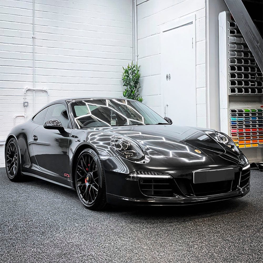 Sports car wrapped in Gloss Coal Black Vinyl Wrap